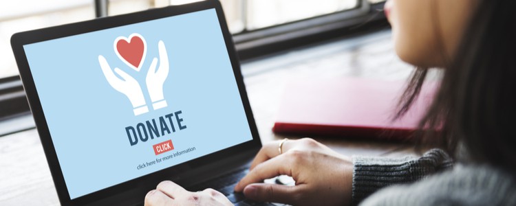 woman donating to charity online