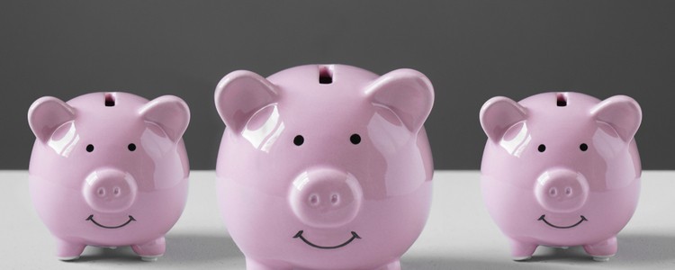 three pink pig-shaped money boxes