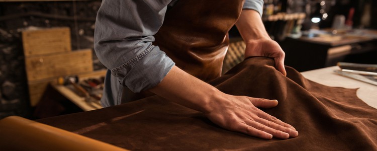 shoemaker working with leather