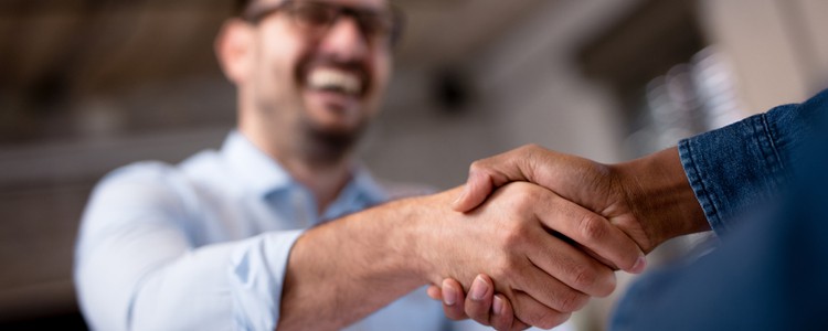 two businesspeople shaking hands