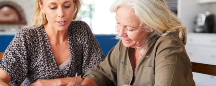 daughter helping mother to write a will