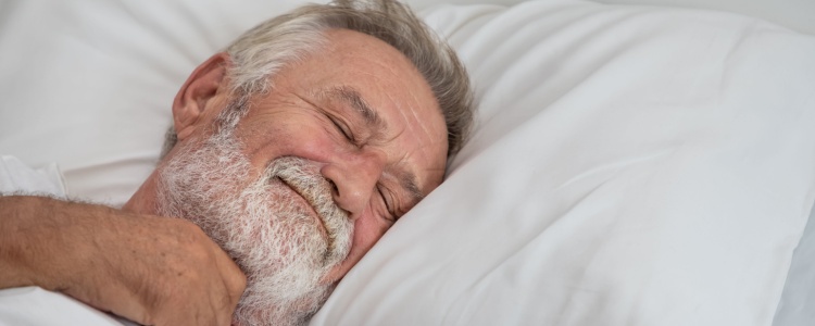 Senior man sleeping happily